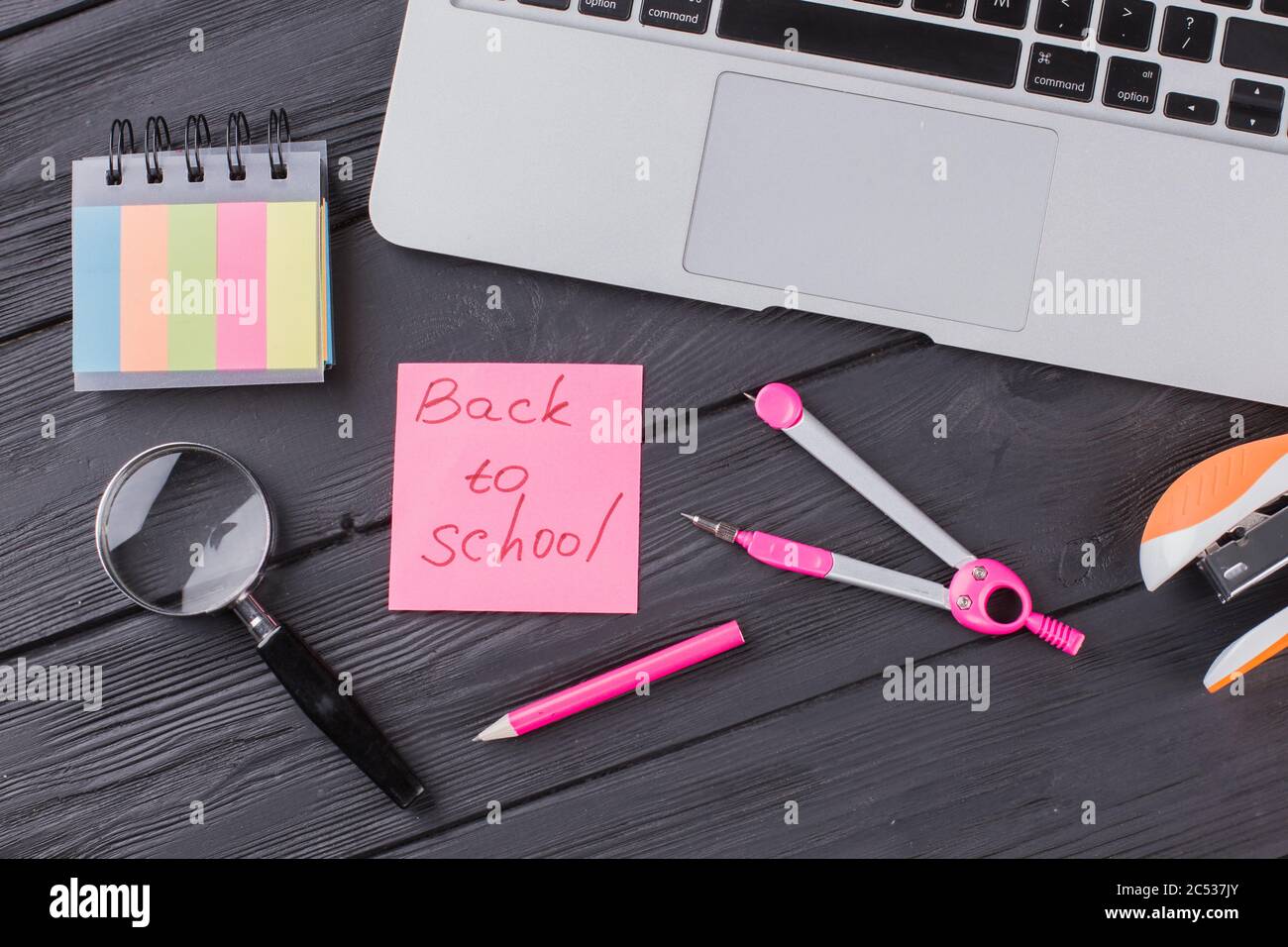 Stationary clerical items on the dark wooden table. Stock Photo
