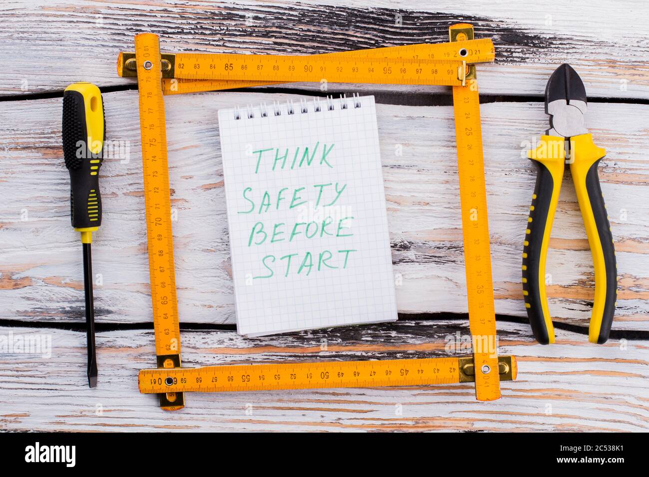 Notepad with ruler square and repair tools Stock Photo - Alamy