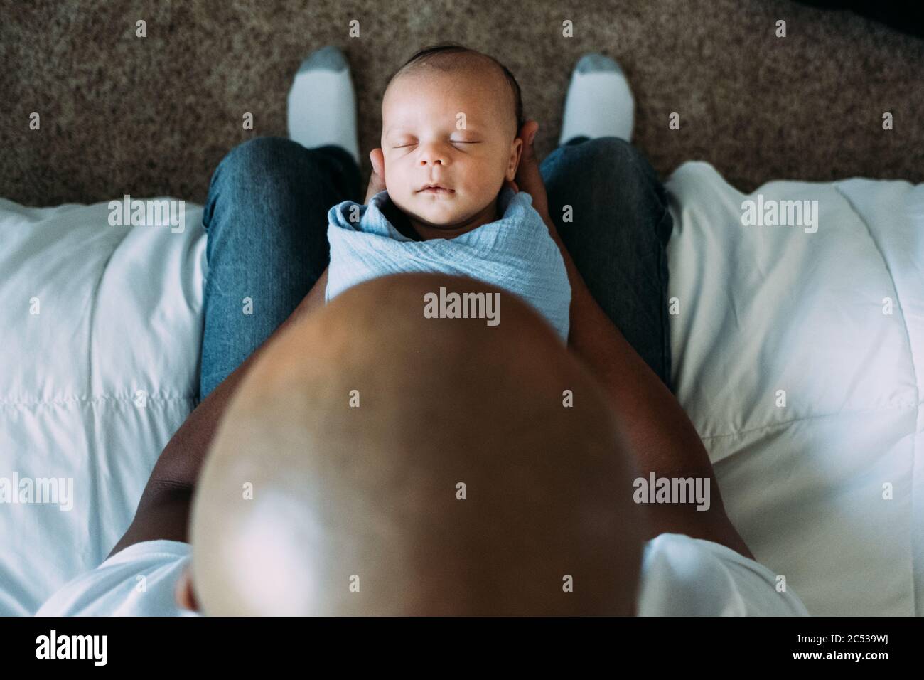 newborn baby sleeping in fathers arms Stock Photo Alamy
