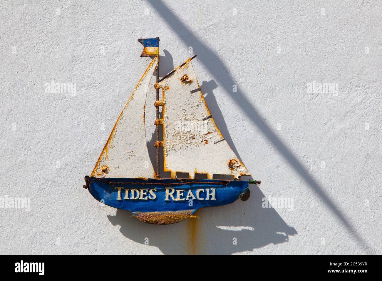 Sailing boat name decoration on the wall of a house in Appledore, North Devon Stock Photo