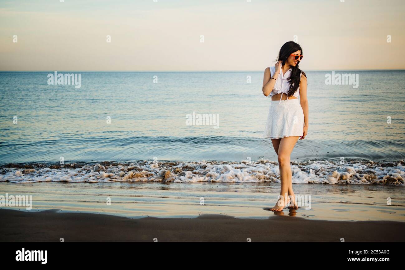Happy young woman beach hi-res stock photography and images - Alamy