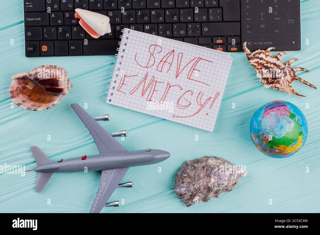 Save energy words on notepad in traveling composition Stock Photo - Alamy