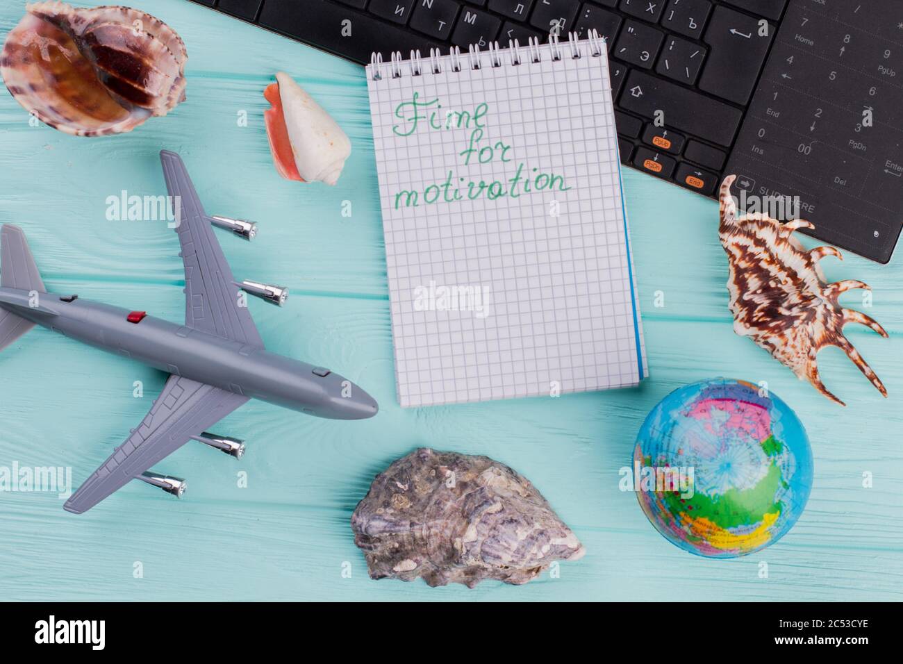Time for motivation words on notebook in traveling composition. Stock Photo
