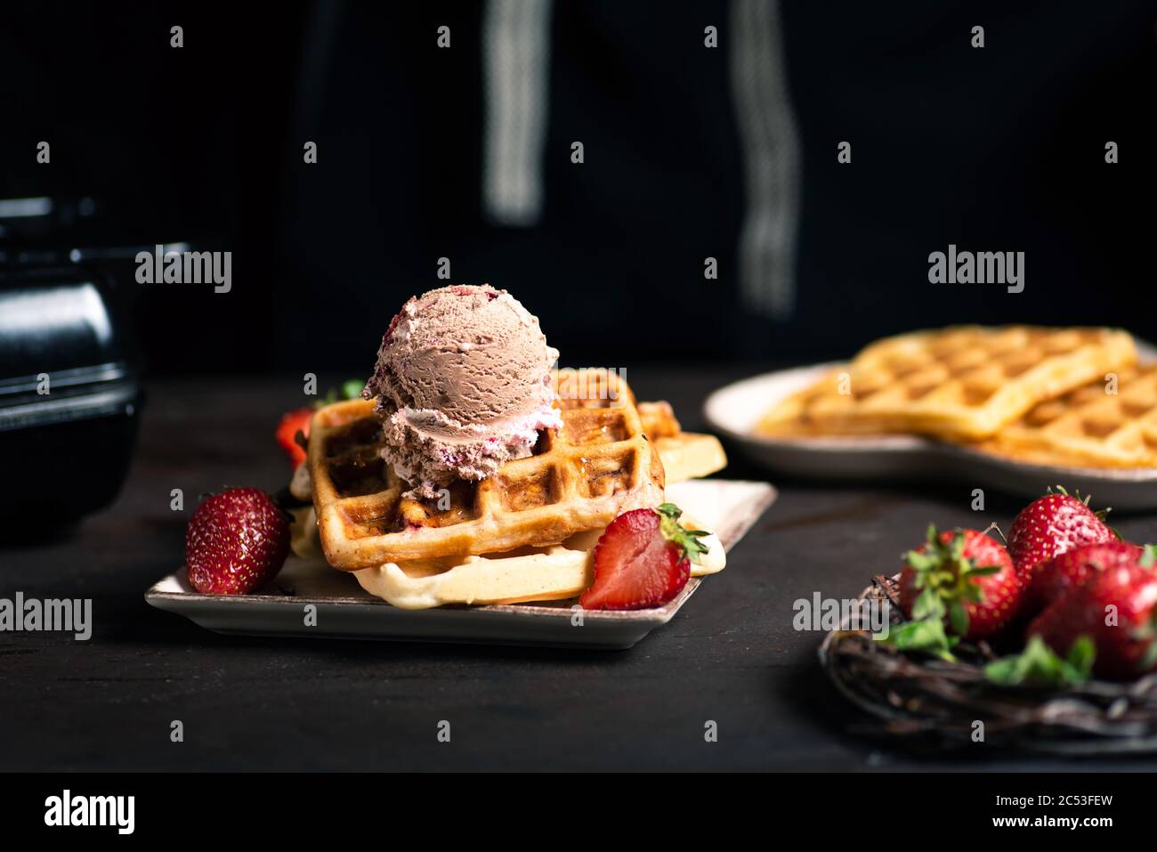 Belgian waffle ice cream sandwich with scoop Stock Photo - Alamy