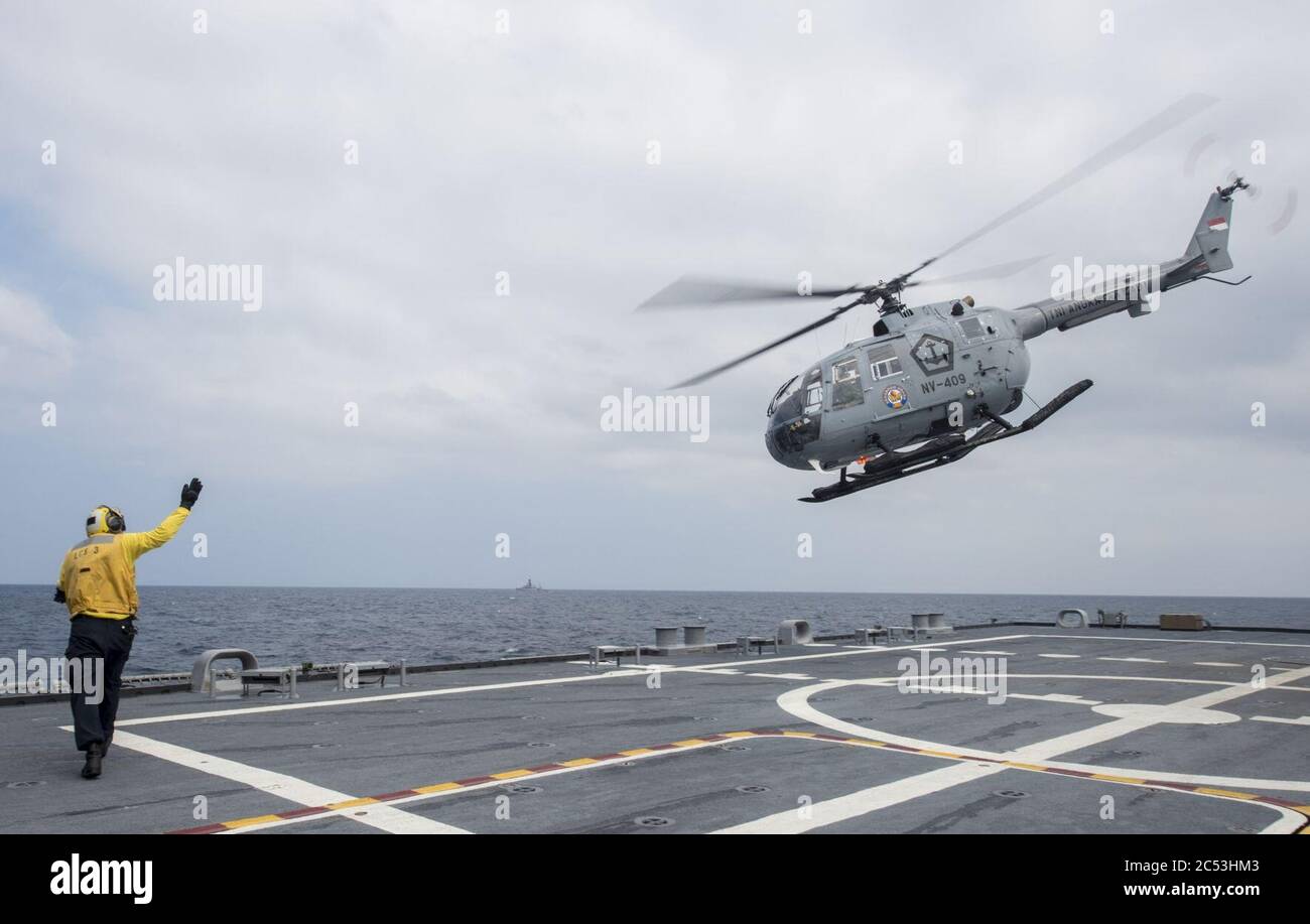 Indonesian Bo 105 takes off from USS Fort Worth (LCS-3) in August 2015. Stock Photo