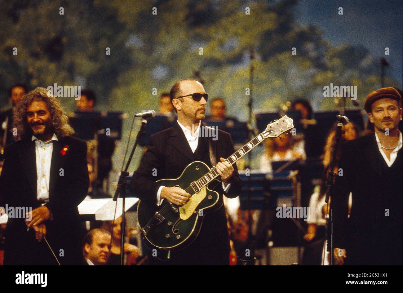 Pavarotti & Friends concert in Modena,Italy 1995: Bono and and The Edge of U2 performing Stock Photo