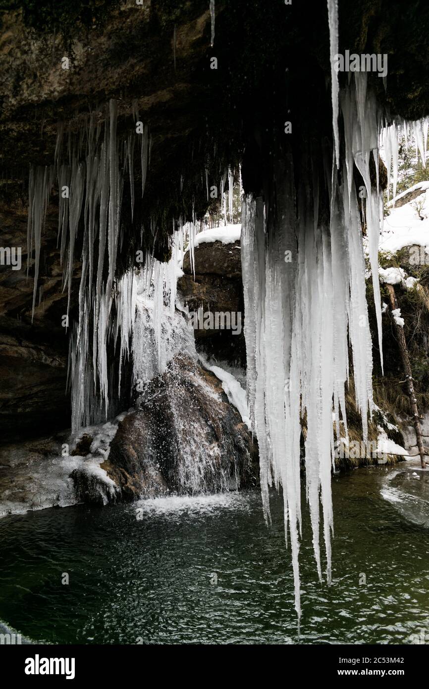 Large natural mountain icicles in winter. Stock Photo