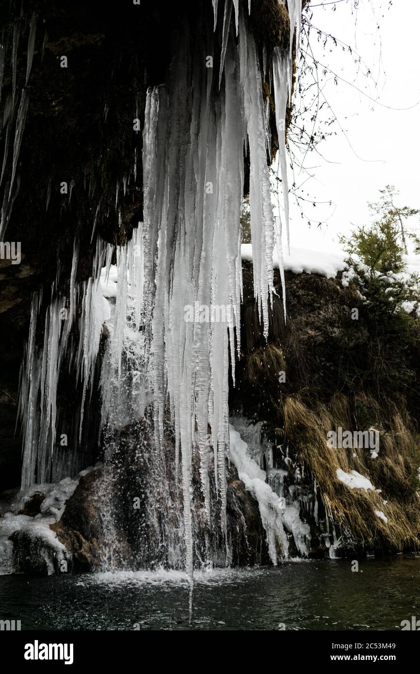 Large natural mountain icicles in winter. Stock Photo