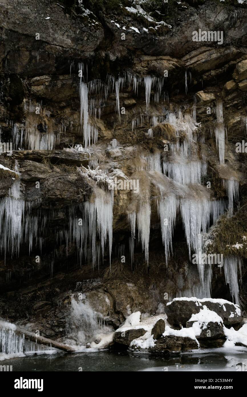 Large natural mountain icicles in winter. Stock Photo