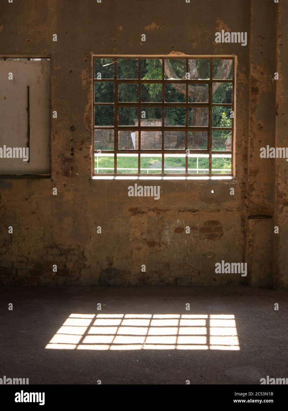 Window with iron bars in old wall Stock Photo - Alamy