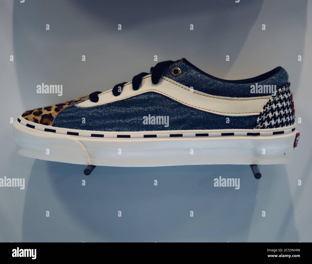 white sneakers with leopard stripe