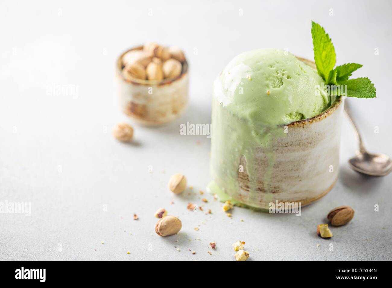 Homemade pistachio ice cream scoop with chopped pistachios on white background Stock Photo Alamy
