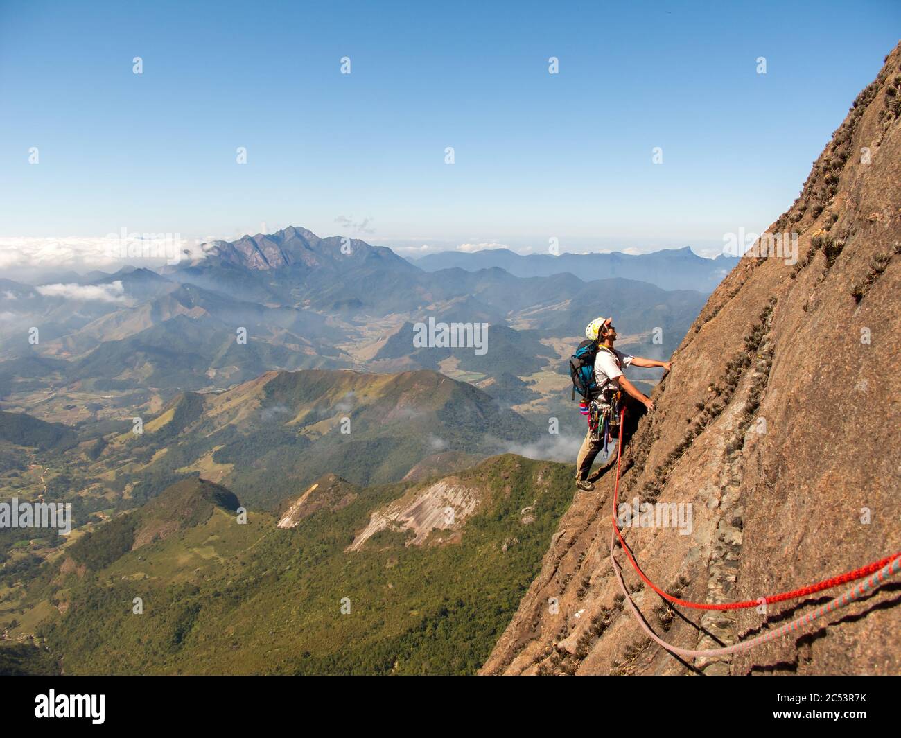 Rock climber climbing a sloping rock wall in Brazil Stock Photo Alamy
