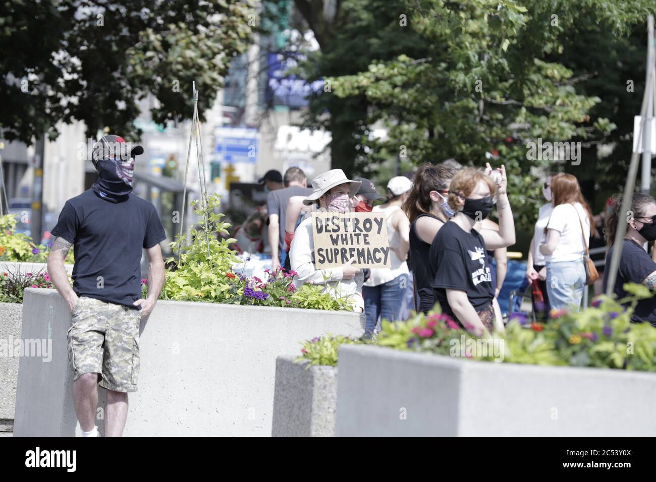 A Protestor holds up a poster saying Destroy White Supremacy Stock Photo