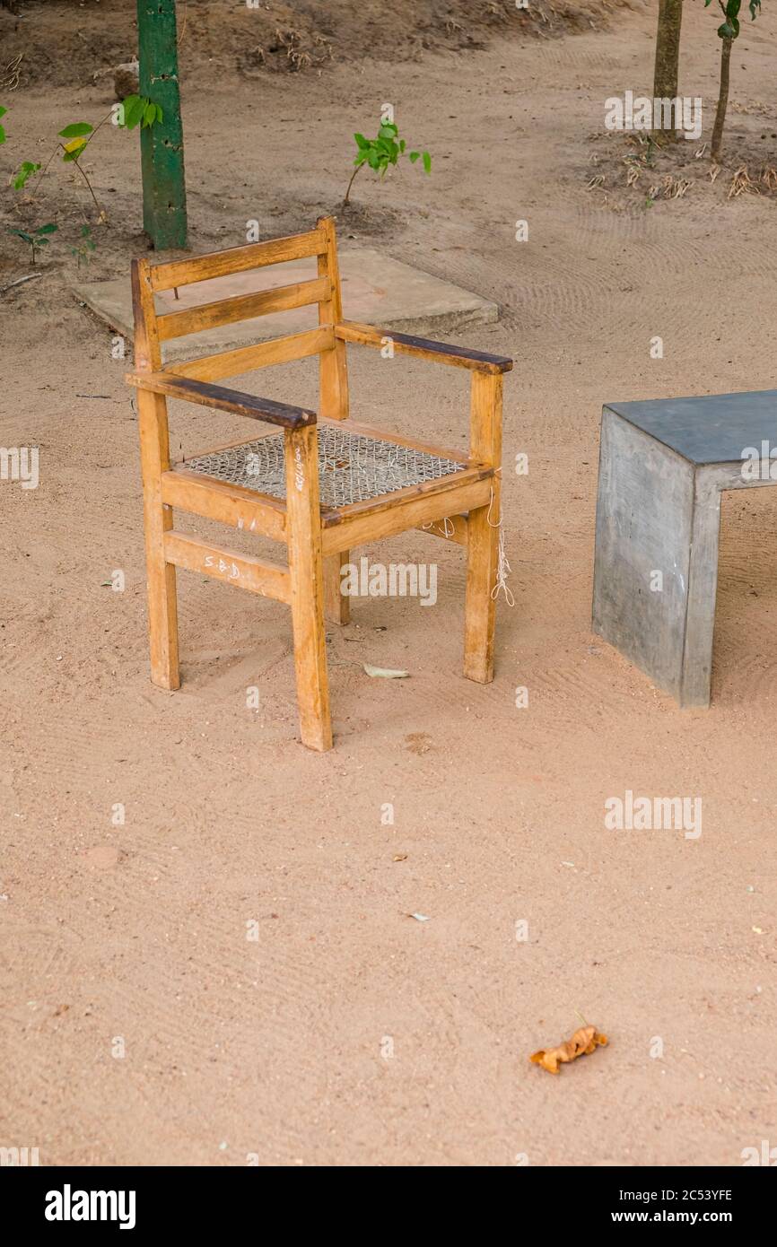 Free wooden chair at the Sigiriya rock on the sandy bottom, Sri Lanka Stock Photo
