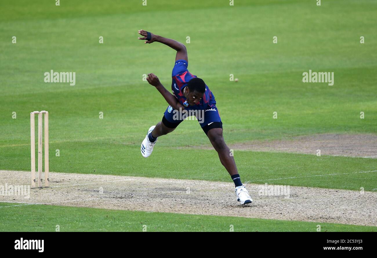 West Indies' Preston McSween bowls during day two of a West Indies Warm Up match at Old Trafford in Manchester. Stock Photo