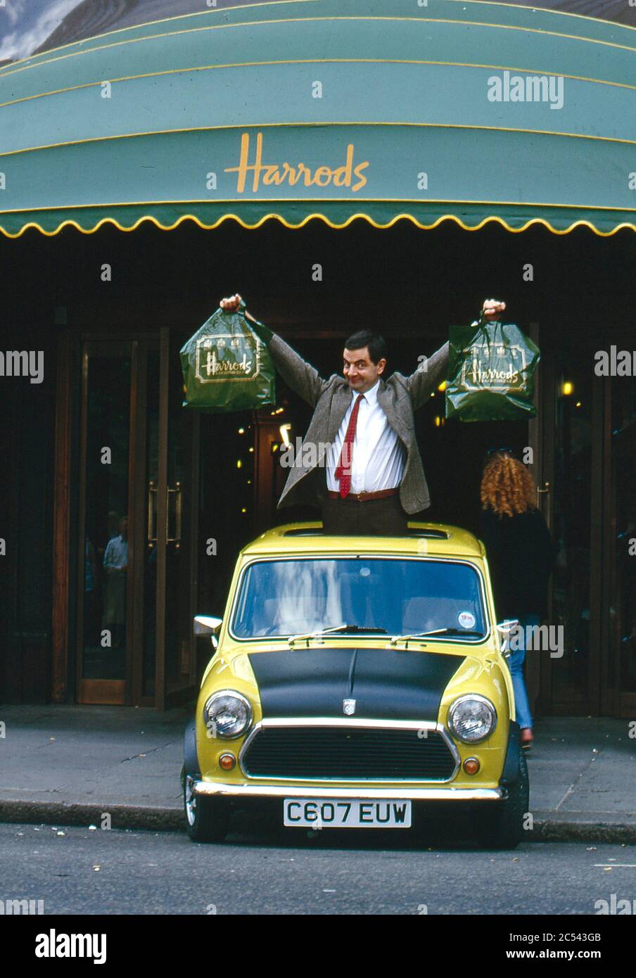 Rowan Atkinson filming Mr Bean at Harrods with Mel Smith 1996 Stock Photo