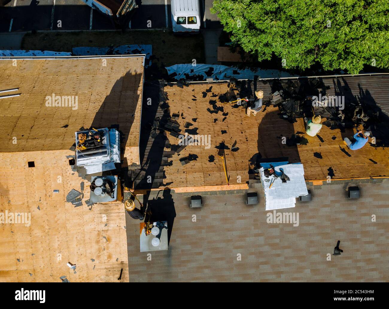 Remove old shingle roof layout and applying new shingles with apartment