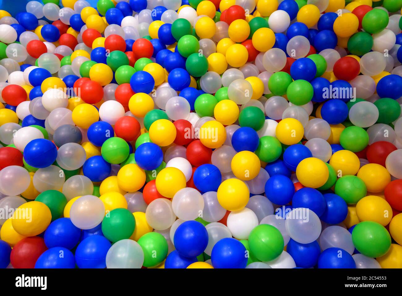 Balls in playground for colorful background. Dry plastic pool with many