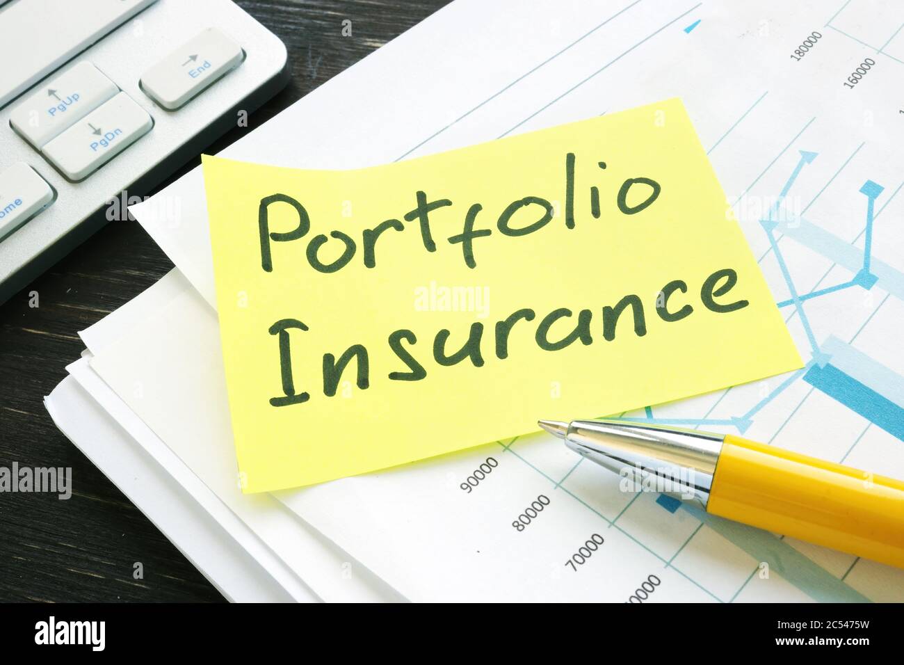 Memo Portfolio Insurance on a pile of business investment papers Stock