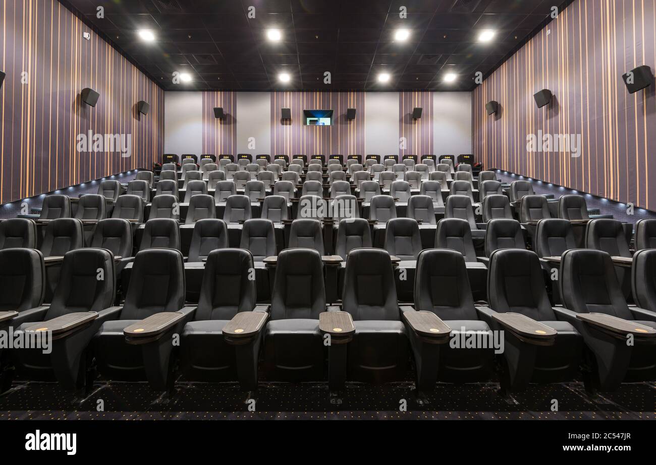 Moscow - July 24, 2014: Front panoramic view of seats in empty cinema hall. Contemporary cinema auditorium design. Inside the comfortable theatre. Pan Stock Photo