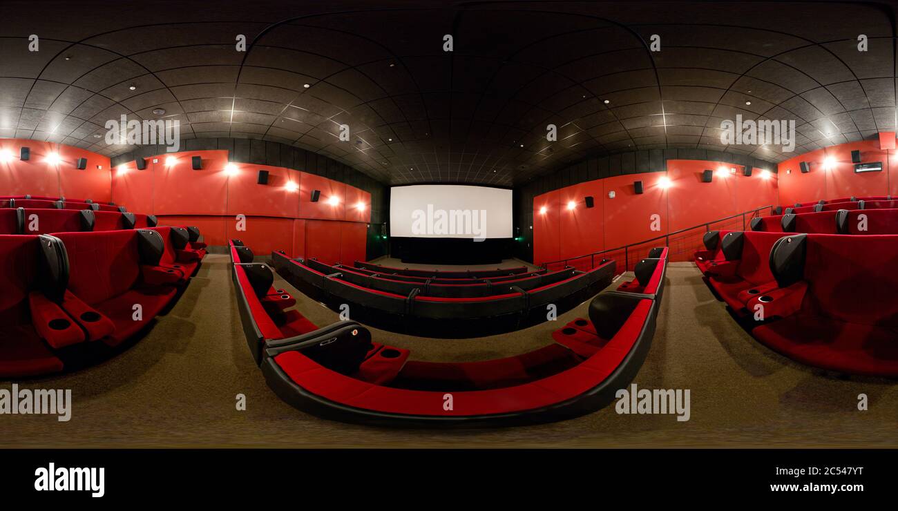 360 degrees full panorama of a modern cinema hall. 360 spherical view of movie theater interior with red seats. Seamless panorama with equirectangular Stock Photo