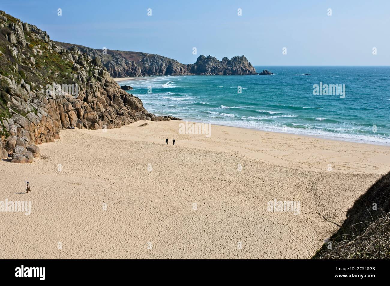 Porthcurno beach and Logan's Rock, Cornwall, England, UK. Stock Photo