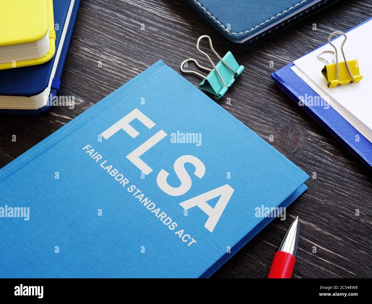 Blue book Fair Labor Standards Act FLSA in the office Stock Photo - Alamy