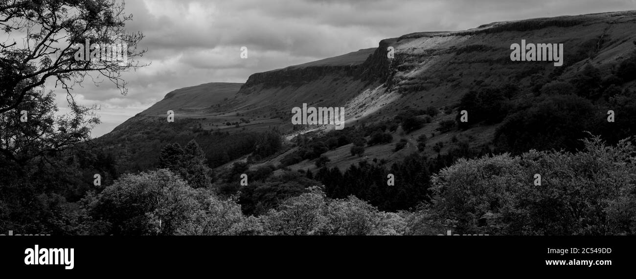 Glenariff mountain, Glenariff Forest Park, Causeway Coast, Northern Ireland in moody black and white Stock Photo