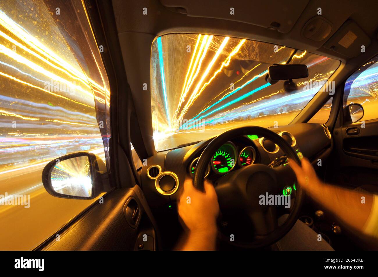 Male driver's view while driving at night on street lighten up