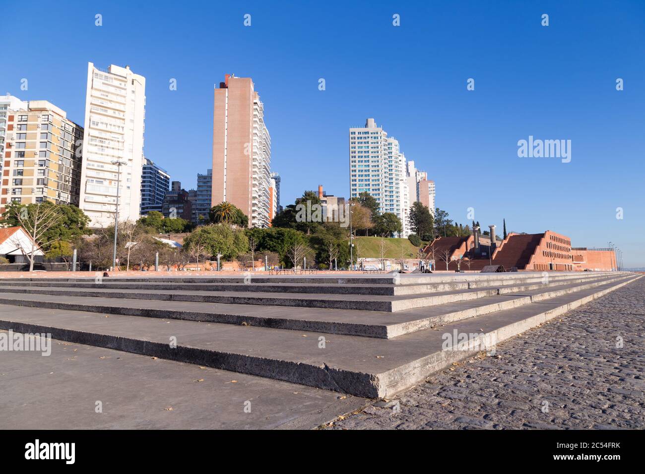ROSARIO, ARGENTINA - JULY 6, 2019: Spain Park placed at the coast of Parana river in Rosario. Panoramic view. The city at the background. Stock Photo
