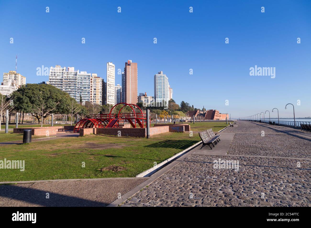 ROSARIO, ARGENTINA - JULY 6, 2019: Spain Park placed at the coast of Parana river in Rosario. Panoramic view. The city at the background. Stock Photo