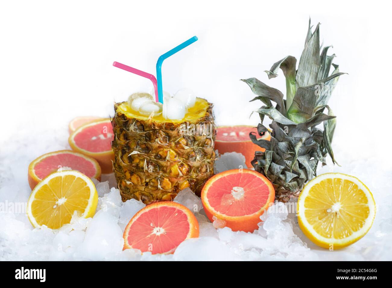 https://c8.alamy.com/comp/2C54G6G/fruit-cocktail-in-pineapple-with-juice-and-a-straw-stands-on-ice-next-to-it-lies-a-lemon-and-an-orange-2C54G6G.jpg