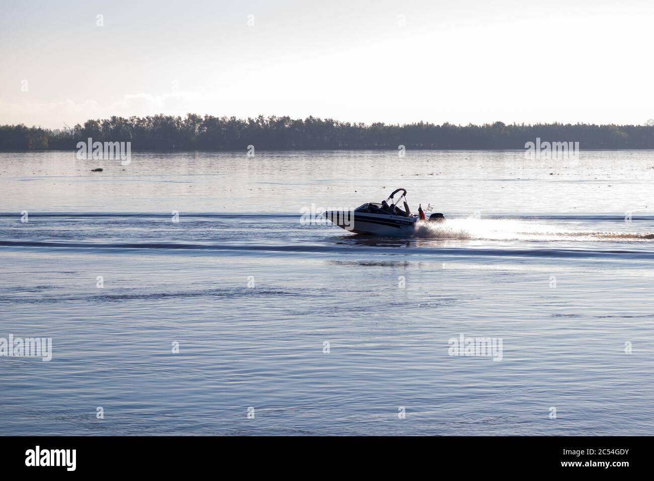 A motorboat sailing for a Parana river in Rosario, Argentina. Sunny day of summer. Stock Photo