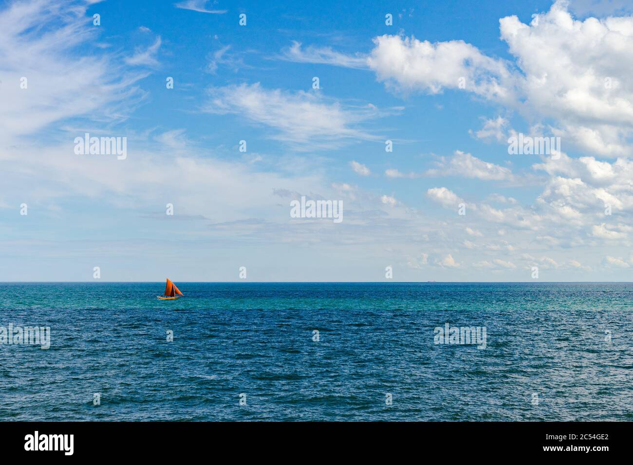 Sailboat on horizon Stock Photo