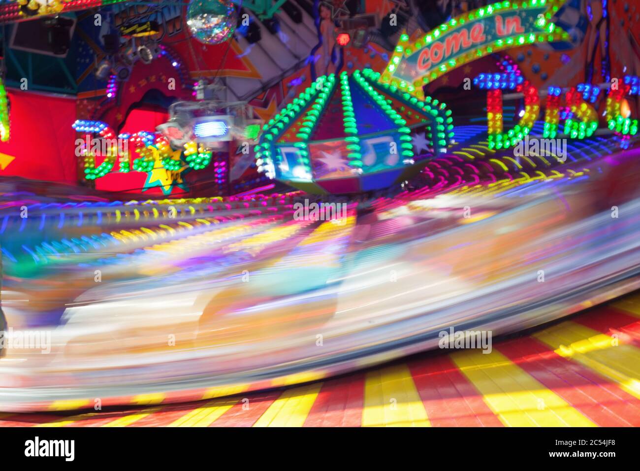 a coloured carousel on the fair in movement Stock Photo