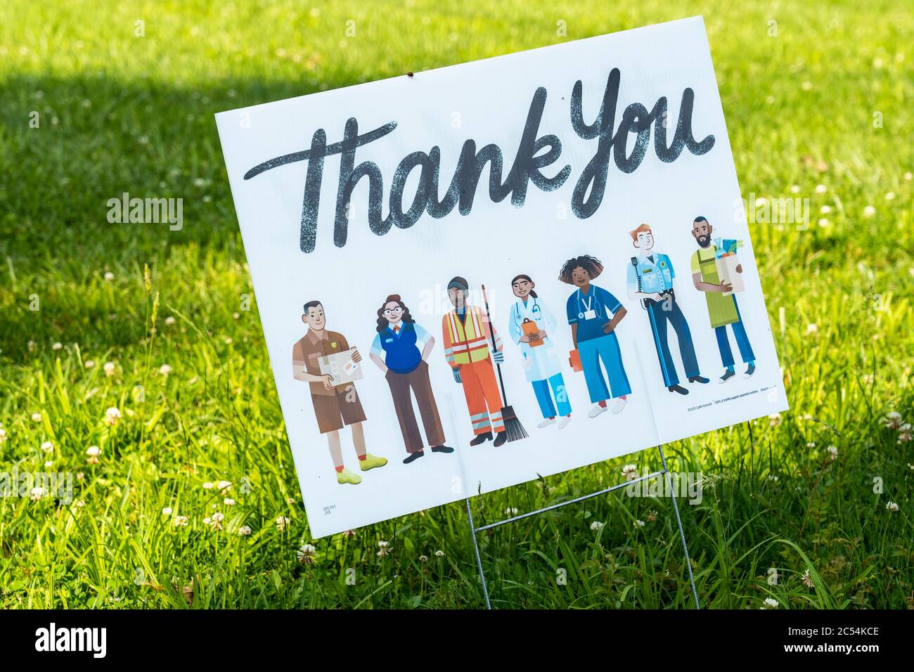 Worcester, PA - June 6, 2020: This thank you sign on a green lawn thanks essential workers during the corona virus pandemic. Stock Photo