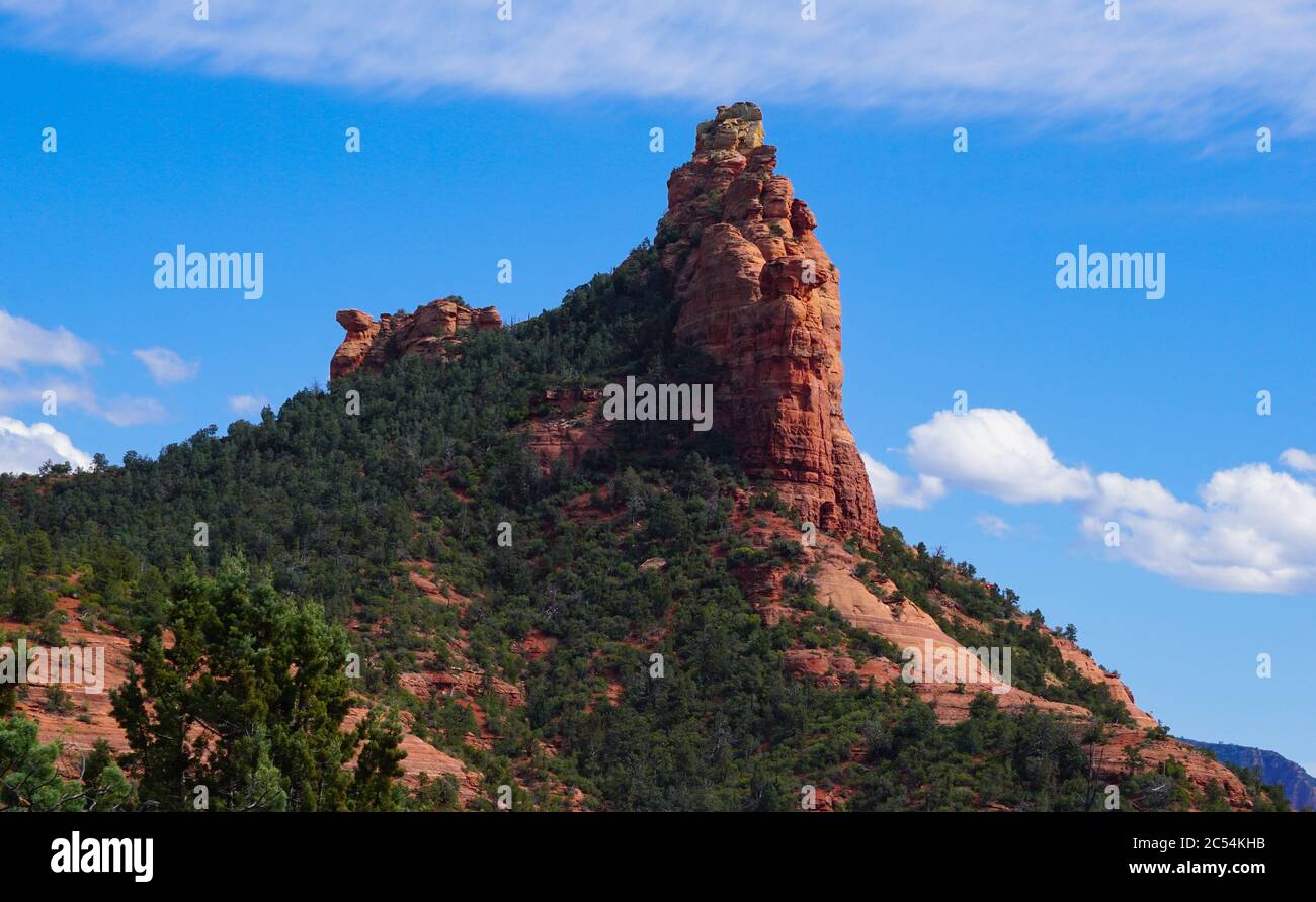 The beauty of one of Sedona's landmark sandstone formations known as Coffee Pot on a clear spring day. Stock Photo