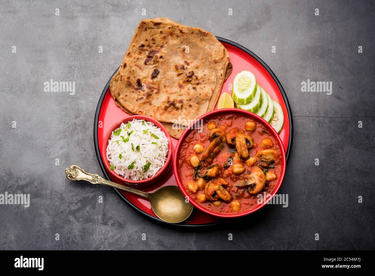 Mushroom sabzi in tomato curry with chickpea and spinach, Indian main