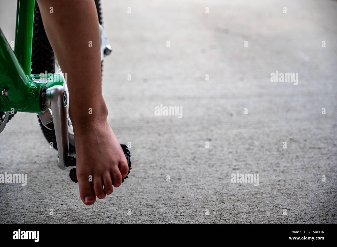 Bare Foot Riders Carefree summer evening riding a bike barefoot Stock Photo - Alamy