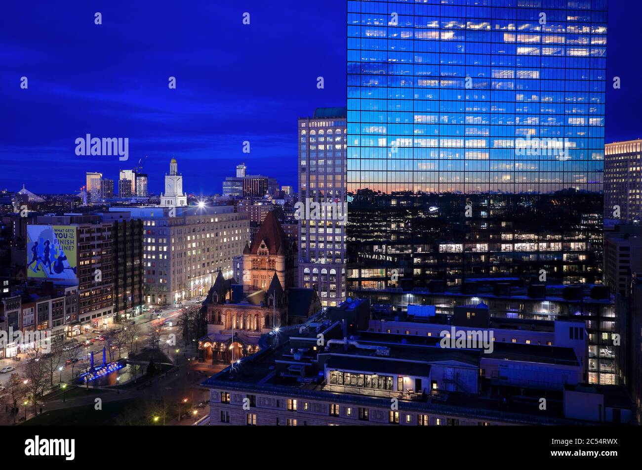 Night view of 200 Clarendon Street formerly known as John Hancock Tower in Copley Square with Trinity Church beside.Boston.Massachusetts.USA Stock Photo