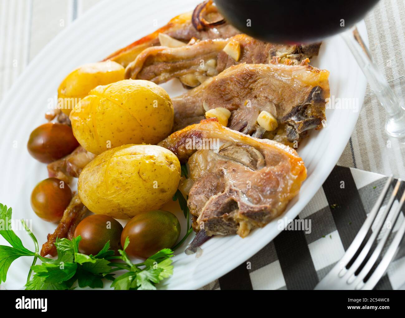 Slow cooked mouton ribs with potato, spanish plate Costillas de cordero ...