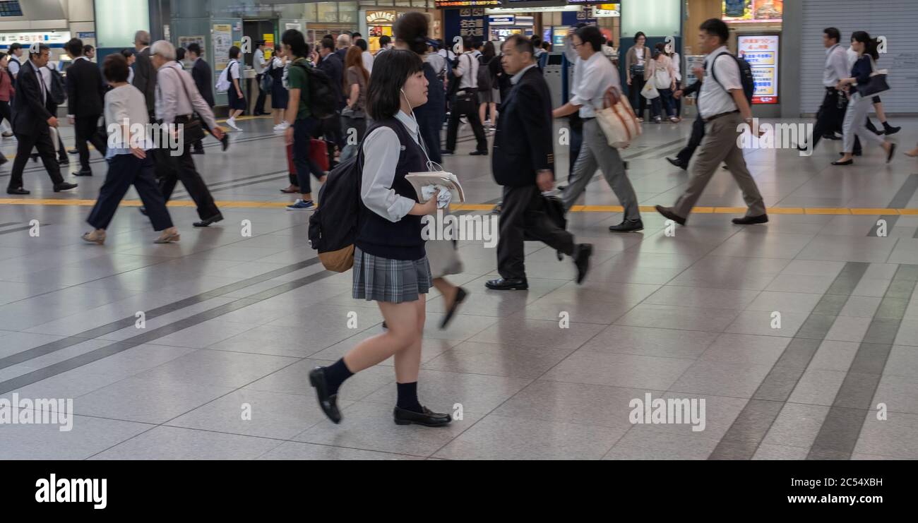 Japanese school children commuting to school at Shinagawa Train Station, Tokyo, Japan Stock Photo