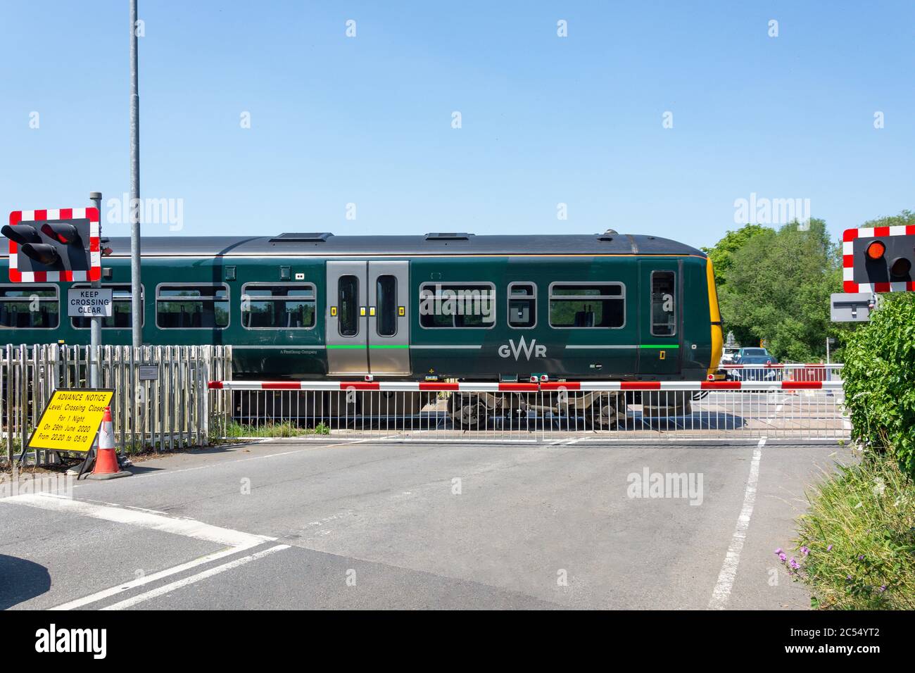 GWR train passing at Kintbury Station level crossing, Station Road, , Kintbury, Berkshire, England, United Kingdom Stock Photo