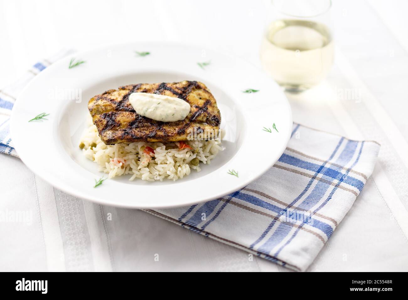 Mahi mahi grilled fish with rice and wine. This lean tropical white