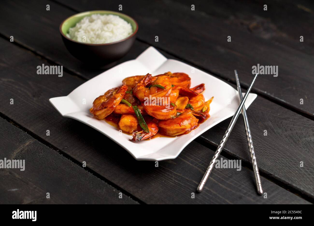 Ketchup shrimp plate on dark background. Ketchup shrimp plate with bowl