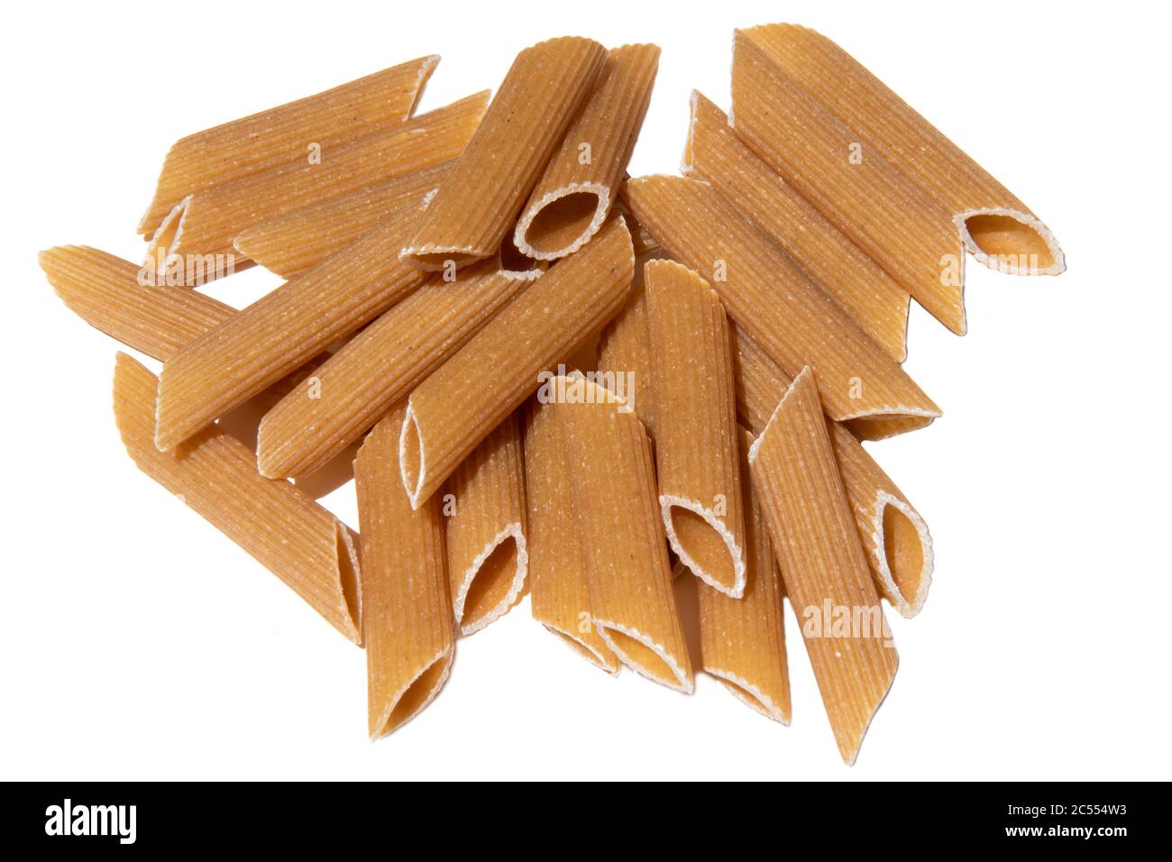 Pasta stack isolated on white. italian wholegrain penne lunch ingredient. healthy eating for vegetarian full of carbohydrate. uncooked grain mediterra Stock Photo