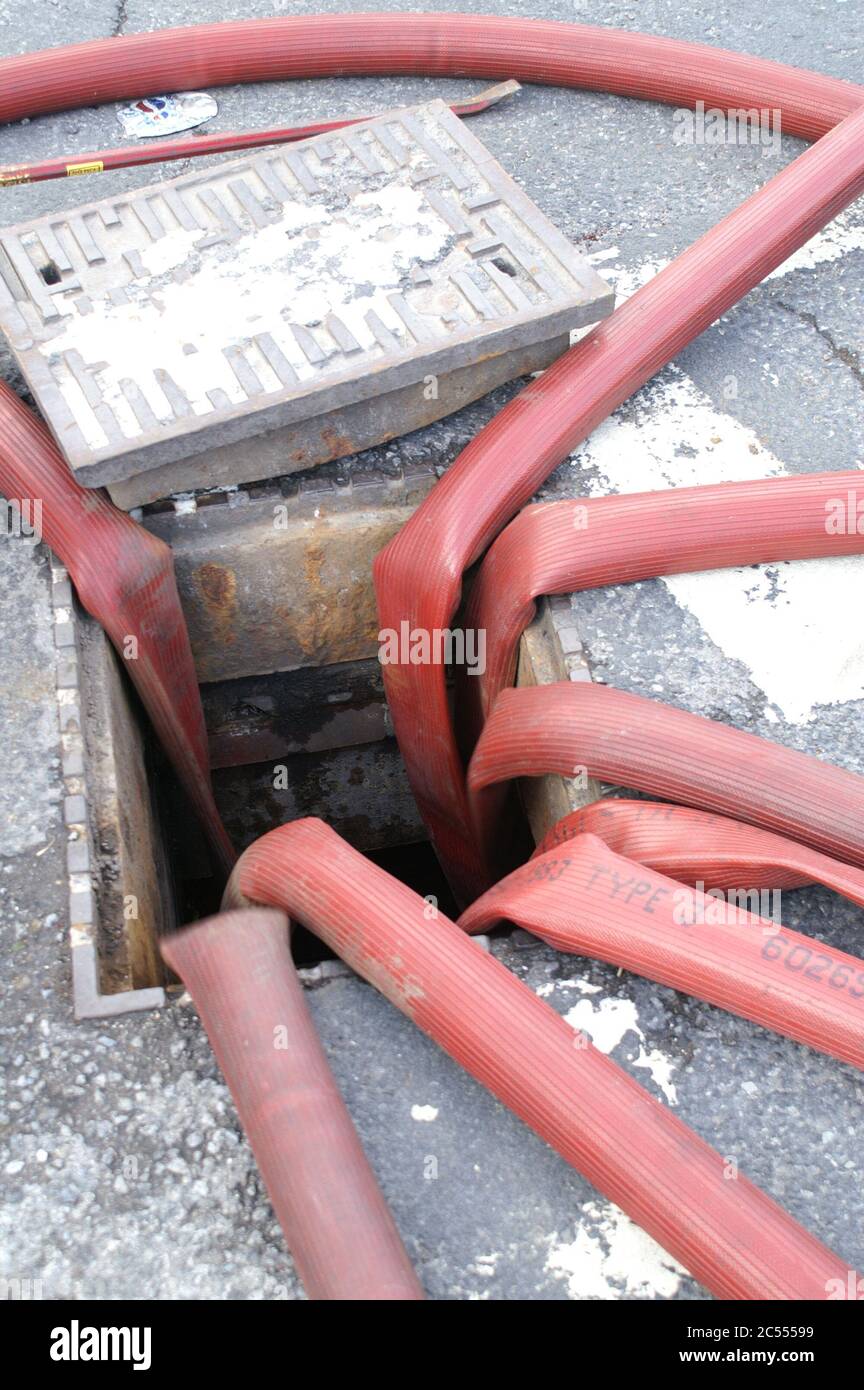 pumping water down the drain Stock Photo Alamy