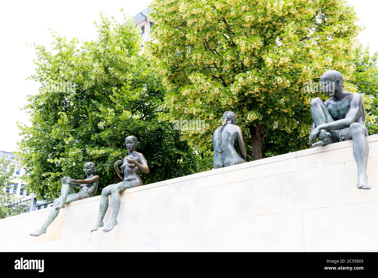 Three girls and a boy, group of figures, bronze figures, memorial, Berlin, Germany Stock Photo