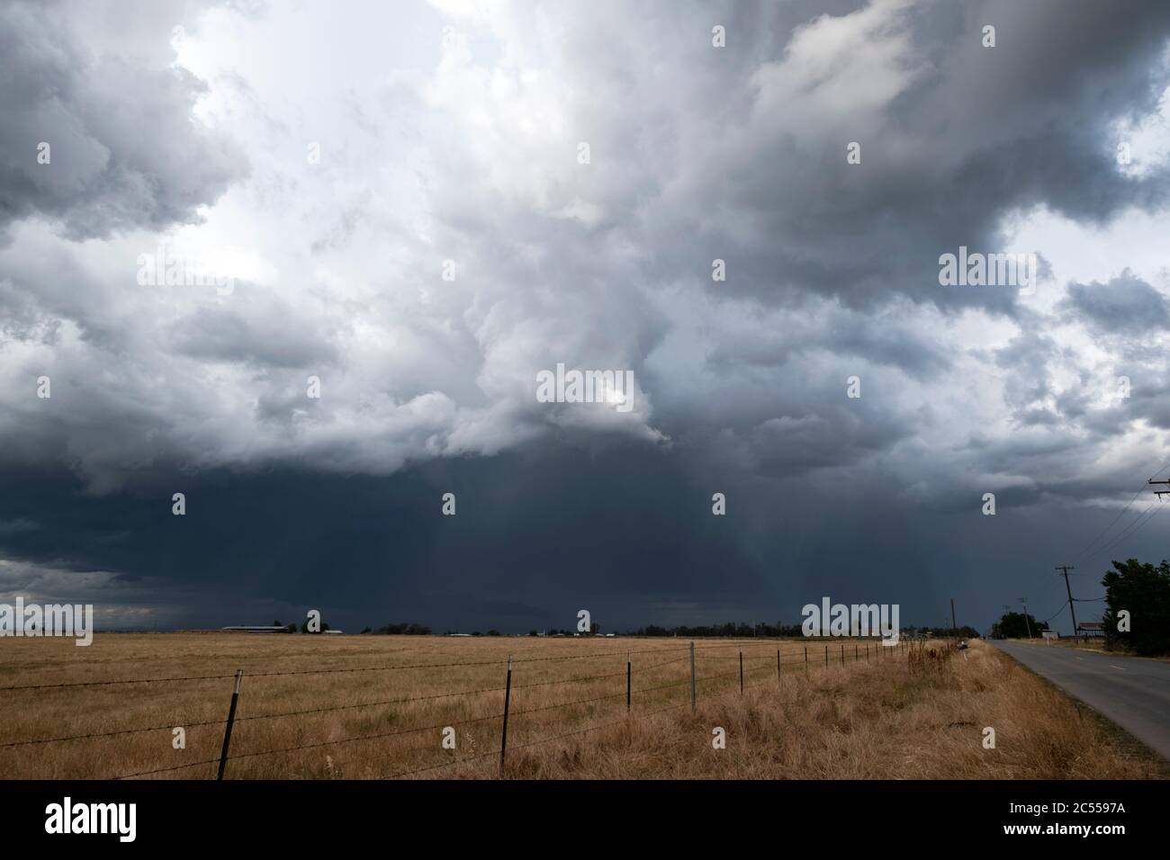 Severe thunderstorm over a field near Elk Grove California Stock Photo